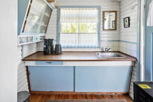 a small kitchen with a sink and a window at 2025-Stege-Ulvshalevej-319 in Stege