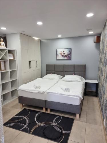 a bedroom with a bed in a room at Biały Zakątek in Trzebnica