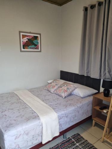 a bedroom with a bed and a picture on the wall at Hotel Giselle Boutique in Boa Vista