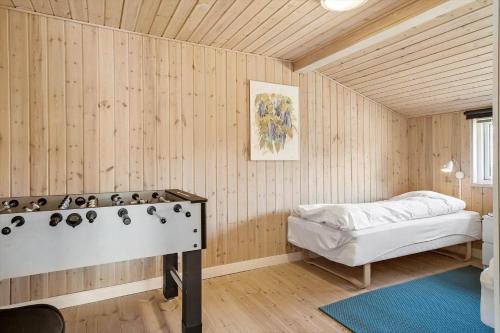 a room with a bed and a table in it at OH156-Hadsund-Halvrebene-26 in Hadsund
