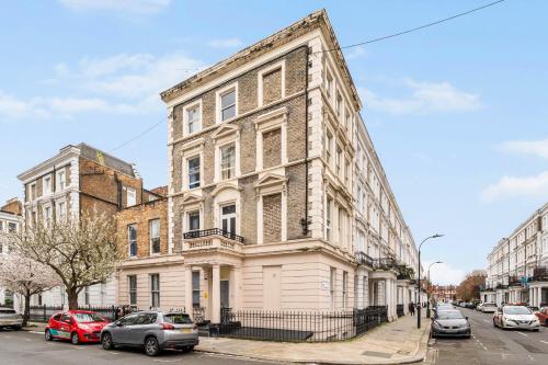 a large building with cars parked in front of it at The Castletown Collection in London
