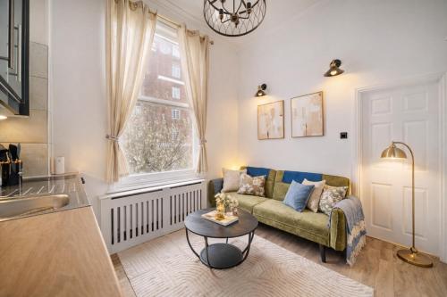 a living room with a couch and a table at The Castletown Collection in London