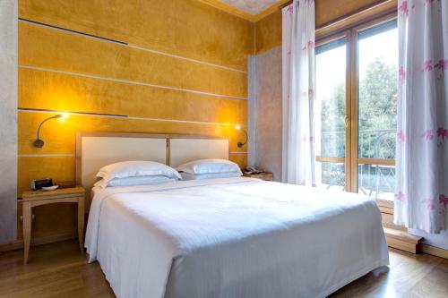 Voodi või voodid majutusasutuse Appartamenti Porta Nuova 80 toas