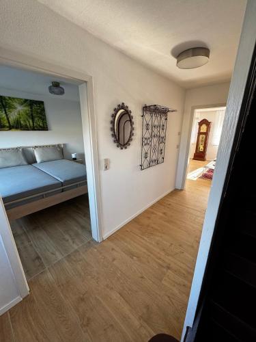 a living room with a bed and a hallway at Karla in Torgelow