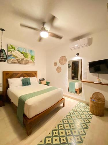 Voodi või voodid majutusasutuse Latino Hotel Boutique toas