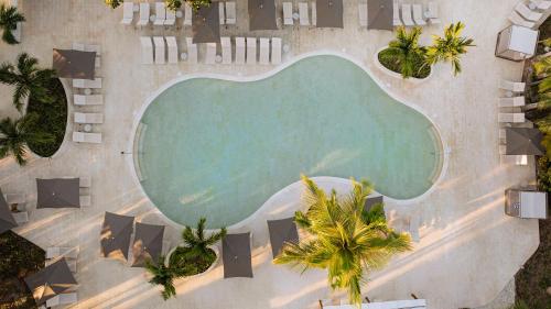 an overhead view of a swimming pool at a resort at Grand Palladium Select Bávaro - All Inclusive in Punta Cana