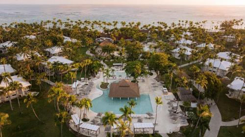 an aerial view of a resort with a pool and the ocean at Grand Palladium Select Bávaro - All Inclusive in Punta Cana