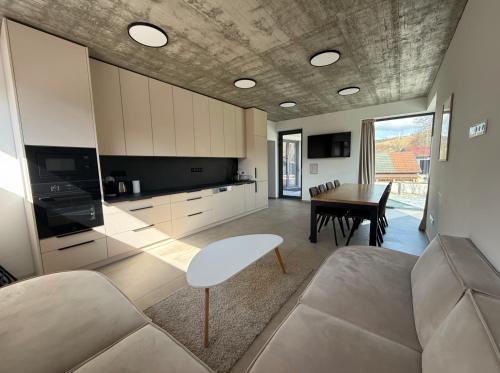 a living room with a couch and a table at Jamy House in Habovka