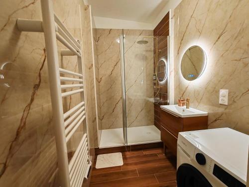 a bathroom with a shower and a sink at Ressource in Casteljaloux