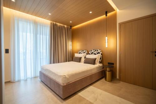 เตียงในห้องที่ Dea Rethymno