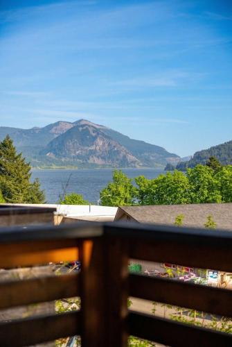 a view of a mountain and water from a fence at Artbliss Hotel in Stevenson