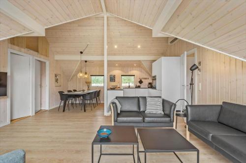 a living room with a couch and a table at 0218-Romo-A-Hveyselsvej-13 in Høm