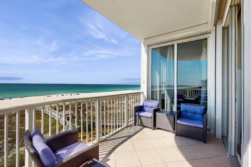 a balcony with chairs and a view of the ocean at Spanish Key 304 in Perdido Key