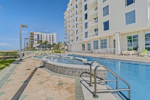 a swimming pool in front of a building at Spanish Key 304 in Perdido Key