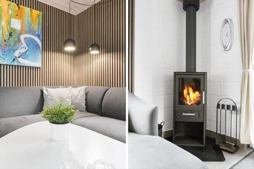 a living room with a couch and a fireplace at 0167-Romo-Julianehab-12 in Høm
