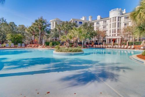 a large swimming pool in front of a large building at Lasata #3112 in Destin