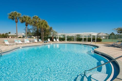 a large pool with blue water in a resort at Maravilla 1114 in Destin