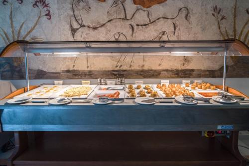 a display case with many different types of food at Antinea Suites Hotel & Spa in Kamari