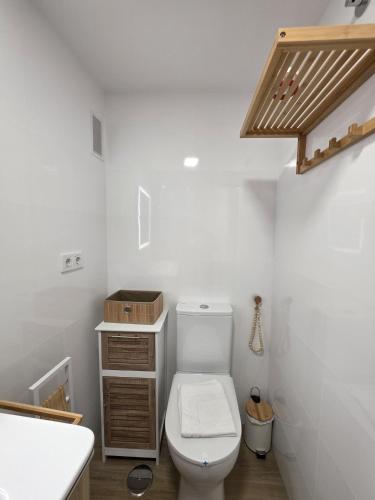 a bathroom with a toilet and a sink at Apartamento Luxury Views IF Benidorm in Benidorm