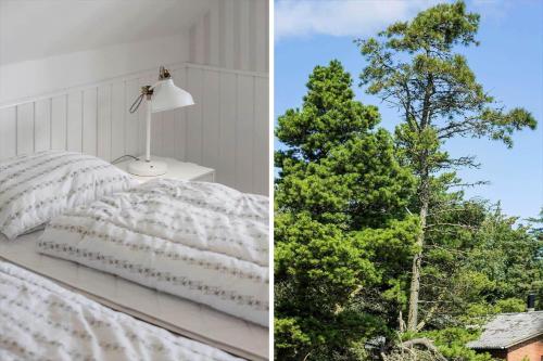 a bedroom with a bed and a tree at 0339-Romo-A-Hveyselsvej-32 in Høm