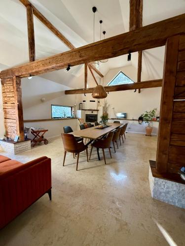 a large living room with a table and chairs at Festung 57 in Bran