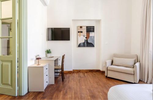a bedroom with a desk and a chair and a table at Limisso Luxury Residence In city Center in Limassol