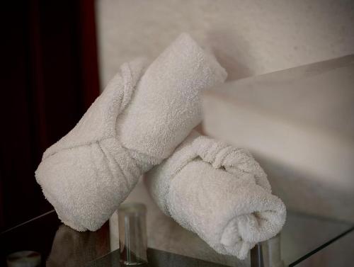 a stack of towels sitting on a table at Royal Pacífico Manzanillo in Manzanillo