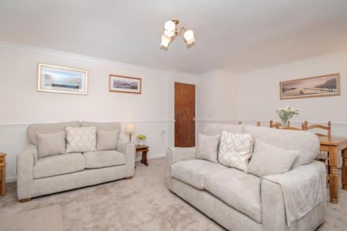 a living room with two chairs and a couch at Aura in Keswick