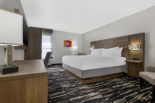 a hotel room with a bed and a television at Best Western Plus Gilbert/Mesa in Mesa