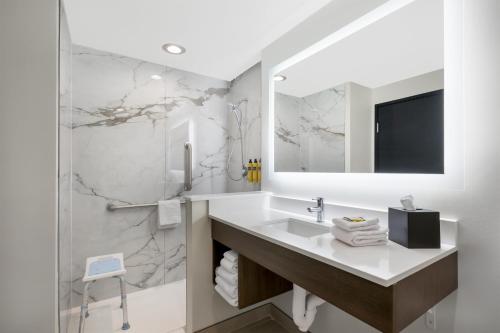 a bathroom with a sink and a mirror at Best Western Plus Gilbert/Mesa in Mesa