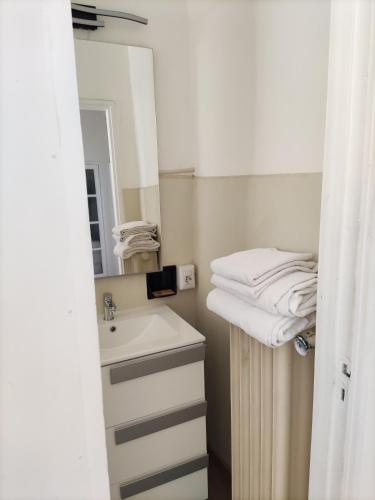 a bathroom with a sink and a mirror at Brunate Funicolare Apartament in Brunate