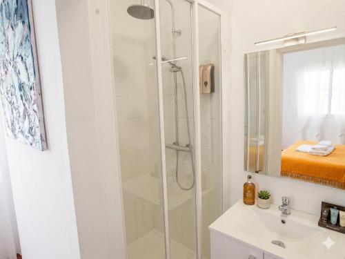 a bathroom with a shower and a sink at Open Sky Villa in Denia
