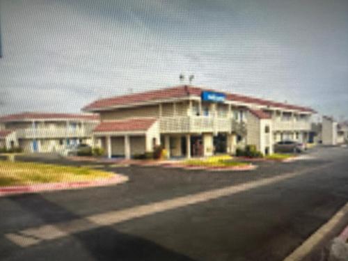 a large building on the side of a street at Motel 6 El Paso East in El Paso