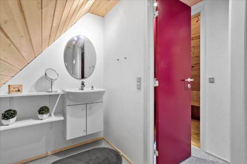 a bathroom with a sink and a mirror at 0185-Romo-Rabjergvej-82 in Høm