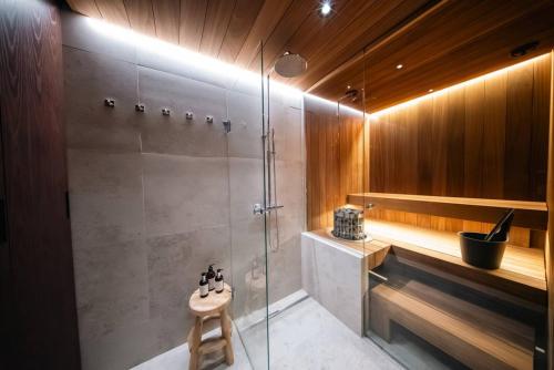 a bathroom with a shower and a sink at Joiku A1 Luxury Chalet in Kolari