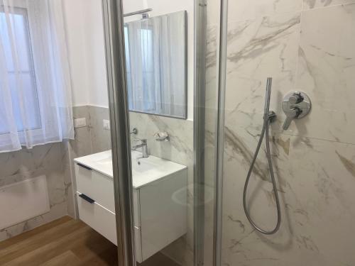 a bathroom with a shower and a sink at Le Camere di Don Nicó in Tarquinia