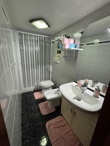 a bathroom with a sink and a toilet at Casa Concettina in Naples