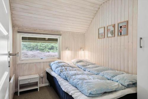 a group of pillows lined up in a room at 0019-Romo-Moritzvej-12 in Høm