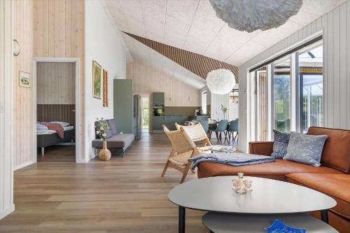 a living room with a couch and a table at 0370-Romo-Vestergardsvaenget-13 in Høm