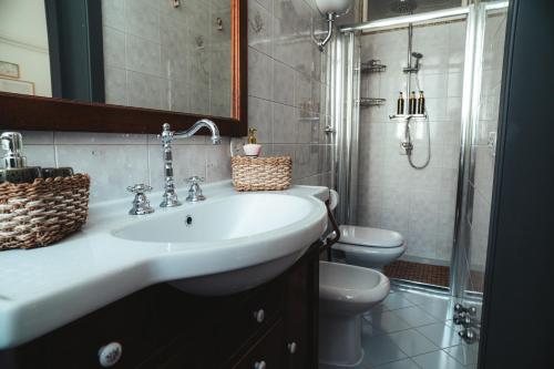 a bathroom with a sink and a toilet and a shower at C'era Una Volta in Monopoli