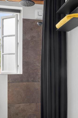 a kitchen with black curtains and a window at 2805-Romo-A-Hveyselsvej-8 in Høm