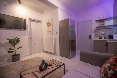 a living room with a couch and a table at live it _ Karditsa in Karditsa
