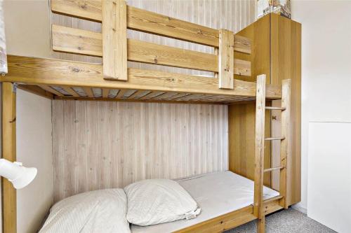 a wooden bunk bed in a small room at 17701-Follenslev-Middelvej-2 in Føllenslev