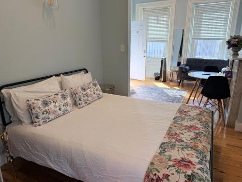 a bedroom with a bed with pillows on it at Bright Private Apartment in University City Walk to Drexel&Near UPenn in Philadelphia