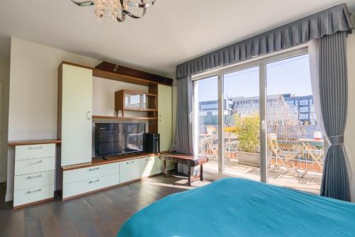 a bedroom with a bed and a large window at Private Room in Coliving - Paris 10min - by Cosynousvoici in Asnières-sur-Seine