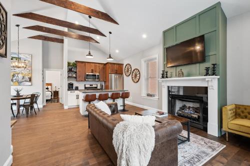 a living room with a couch and a fireplace at Luxurious Design Easy Access to Downtown Pittsburgh Sleeps 4 in Pittsburgh