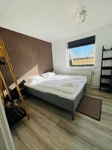 a bedroom with a large bed and a window at Entire Home in Billund Center in Billund