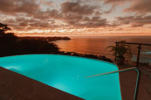 a swimming pool with a view of the ocean at Private Cliffside Villa with Infinity Pool in Sayulita
