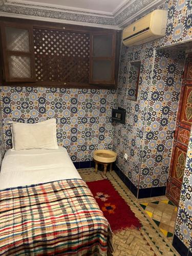 Llit o llits en una habitació de Riad Tarik