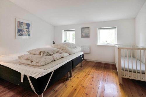 a bedroom with a bed with two pillows on it at 13360-1-Asnaes-Mejsevej-6 in Asnæs